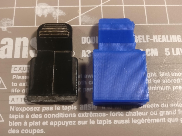 3d printed part next to a broken part